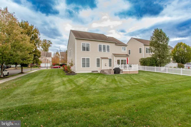 a view of a house with a big yard
