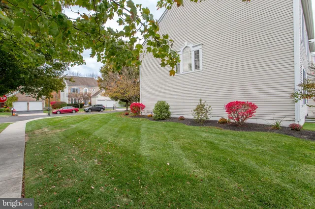 a front view of a house with backyard