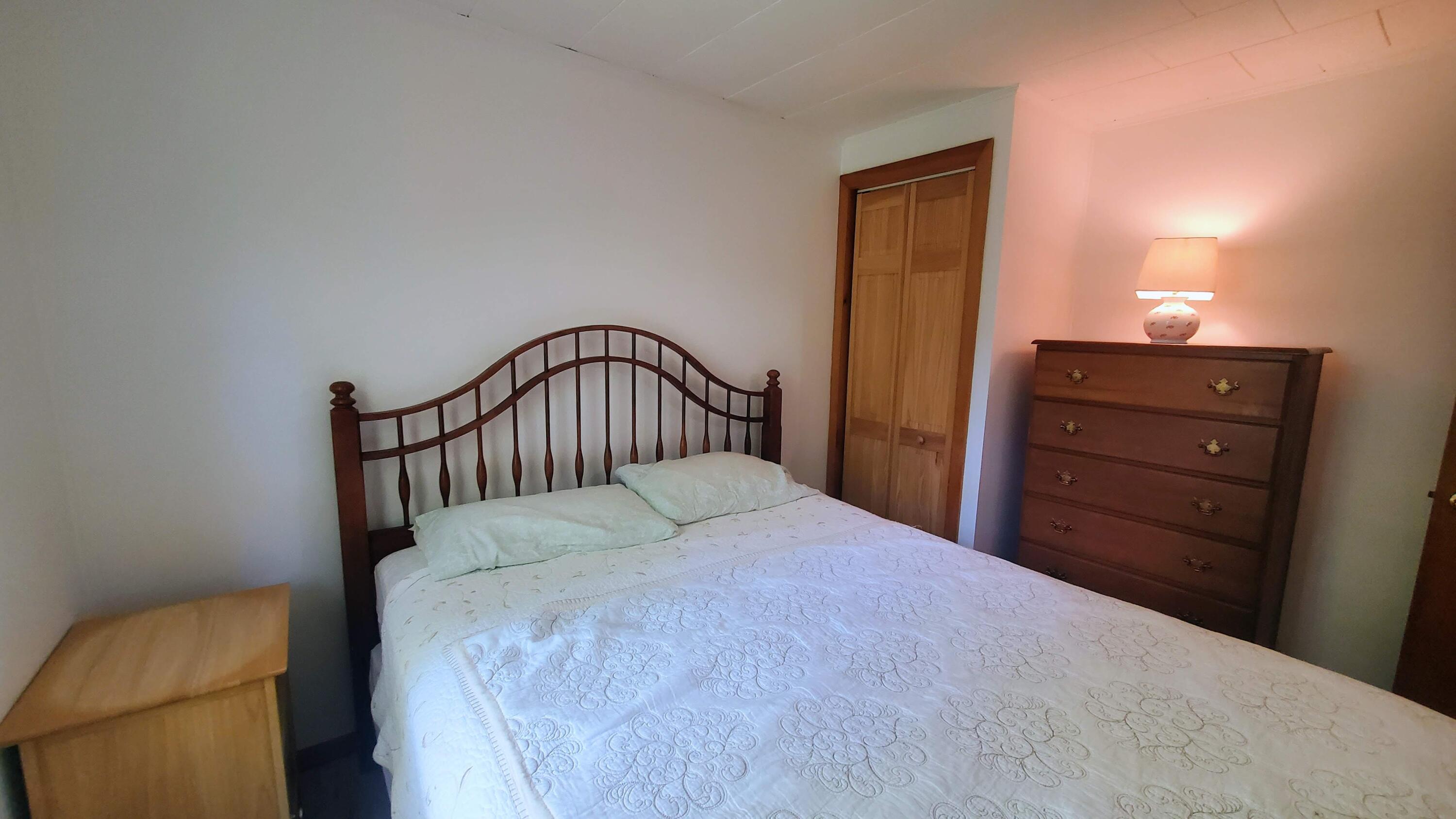 66 Uncle Edwards Road Mashpee, MA 02649 - Photo 12 of 18 a bedroom with a bed and wooden floor