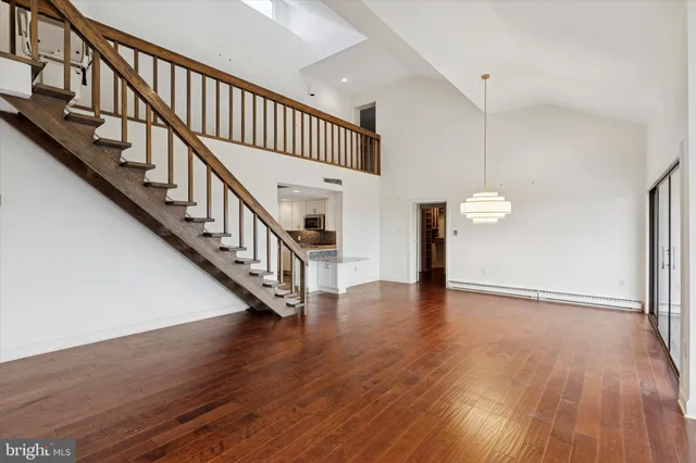 a view of an entryway with wooden floor