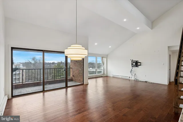 a view of an empty room with glass door