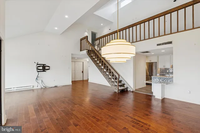 a view of entryway with wooden floor