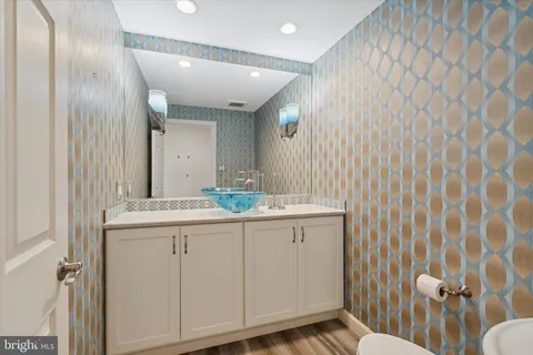 a bathroom with a sink and mirror