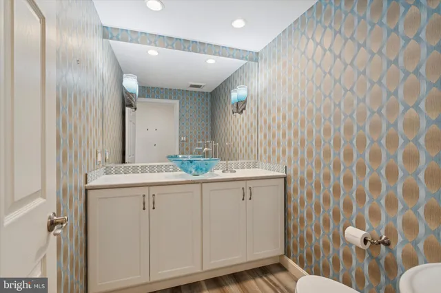 a bathroom with a sink and mirror