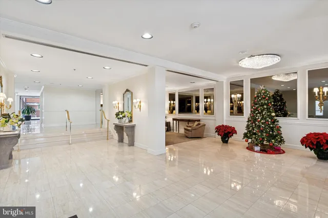 a view of a room with gym equipment and large windows