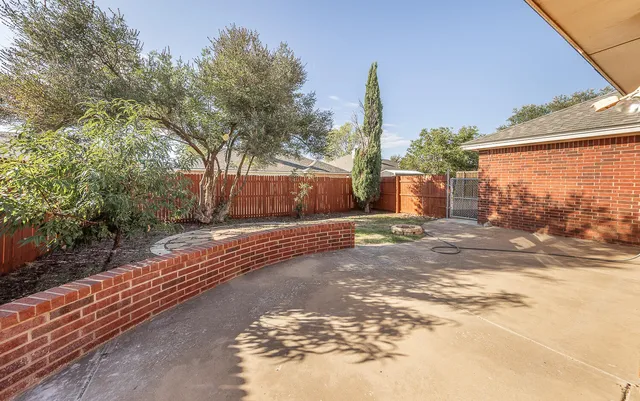 a view of a backyard of the house