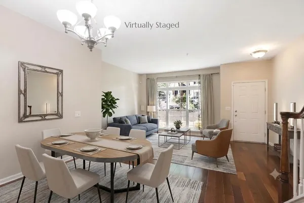a view of a dining room with furniture window and wooden floor