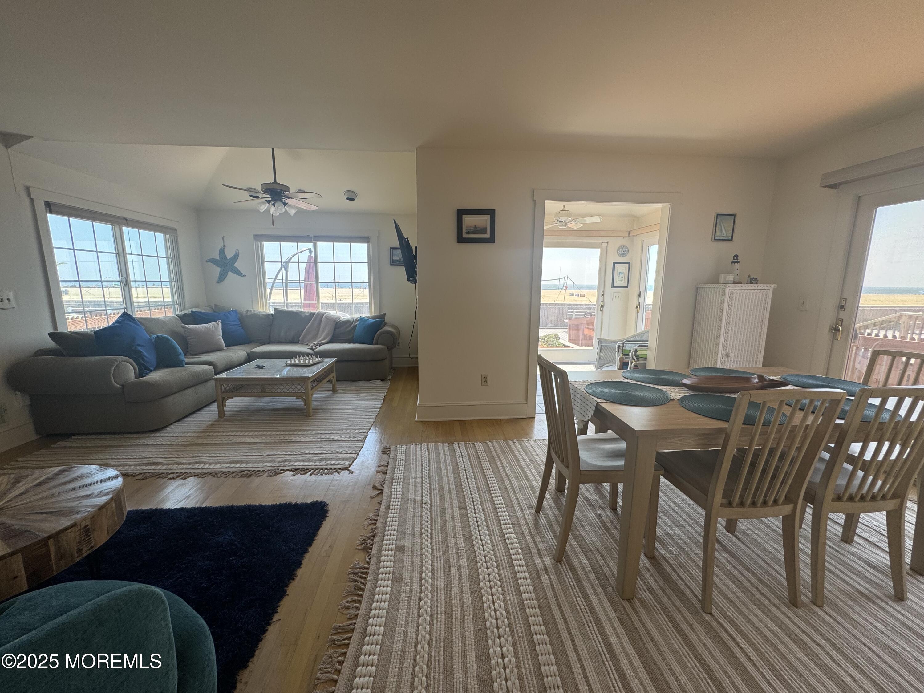 115 Boardwalk Point Pleasant Beach, NJ 08742 - Photo 15 of 23 a view of a dining room with furniture and wooden floor