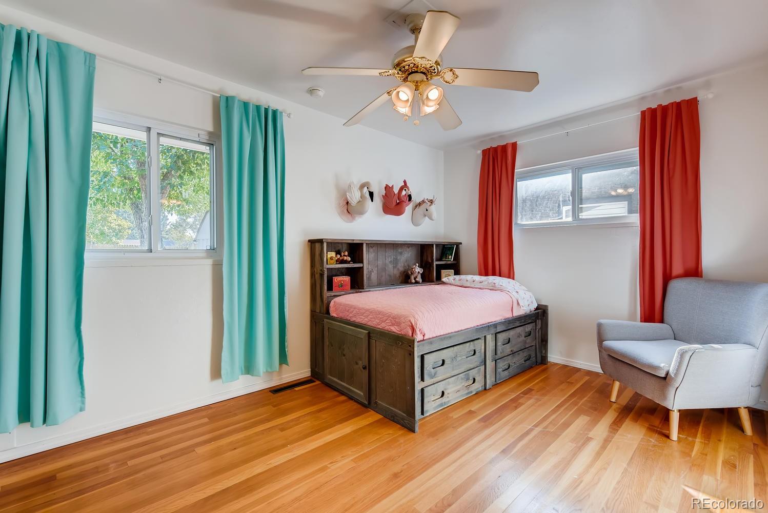 2621 Paseo Road Colorado Springs, CO 80907 - Photo 14 of 27 a bed sitting in a bedroom next to a window