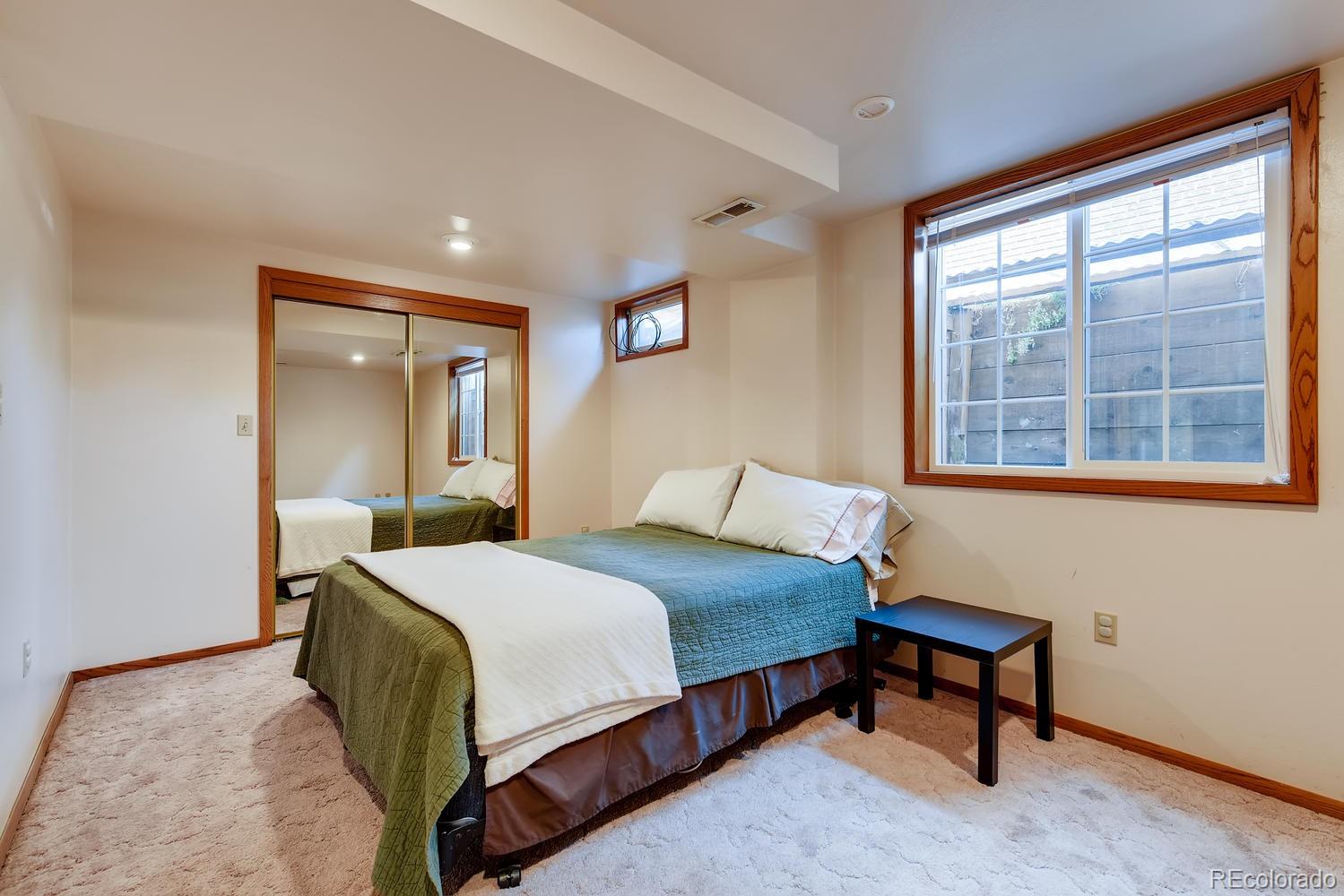 2621 Paseo Road Colorado Springs, CO 80907 - Photo 19 of 27 a bedroom with a bed and a window
