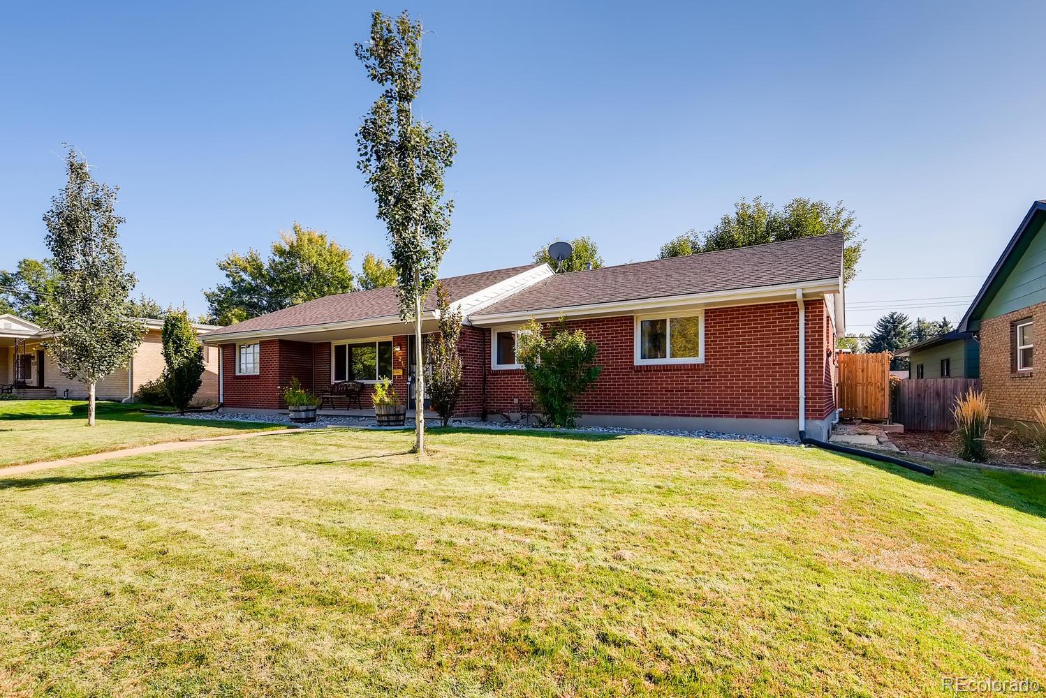 2621 Paseo Road Colorado Springs, CO 80907 - Photo 2 of 27 a front view of a house with a garden