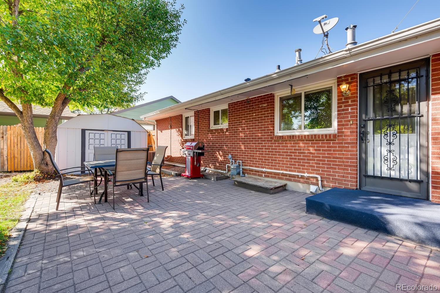 2621 Paseo Road Colorado Springs, CO 80907 - Photo 21 of 27 a backyard of a house with table and chairs