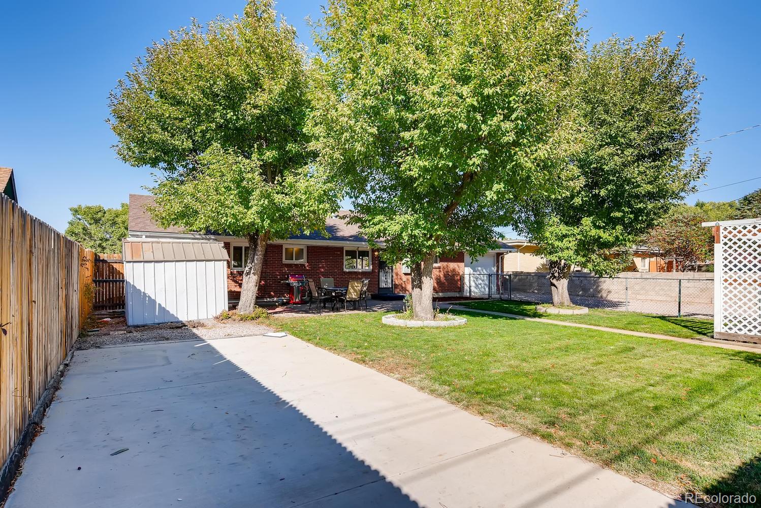2621 Paseo Road Colorado Springs, CO 80907 - Photo 22 of 27 a view of a house with backyard and a tree