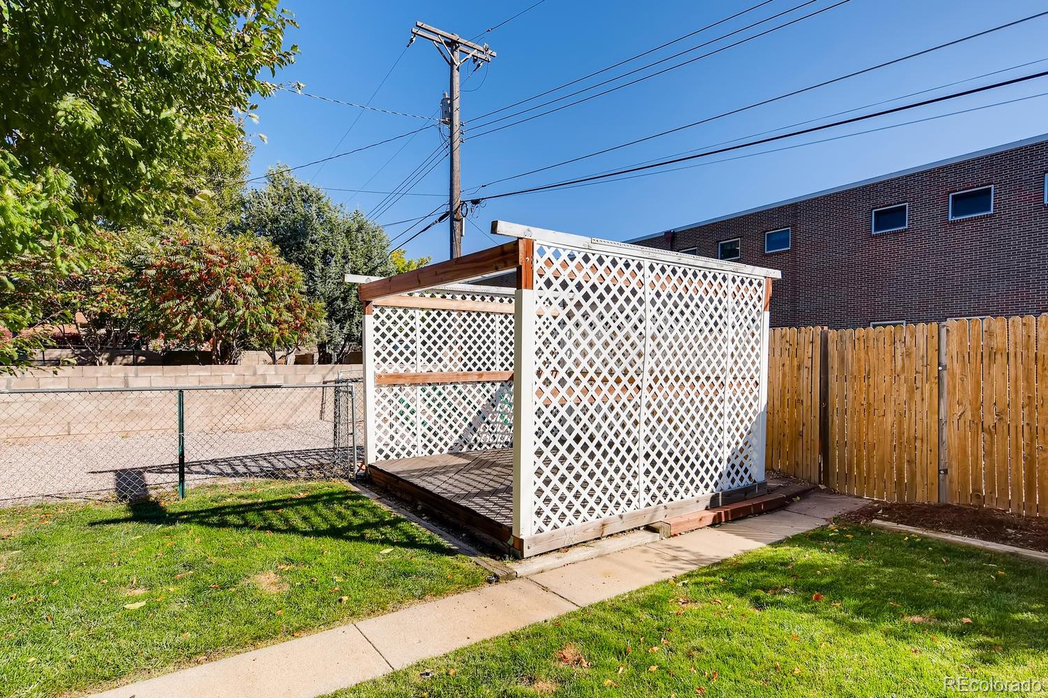 2621 Paseo Road Colorado Springs, CO 80907 - Photo 23 of 27 a view of a backyard with a fence