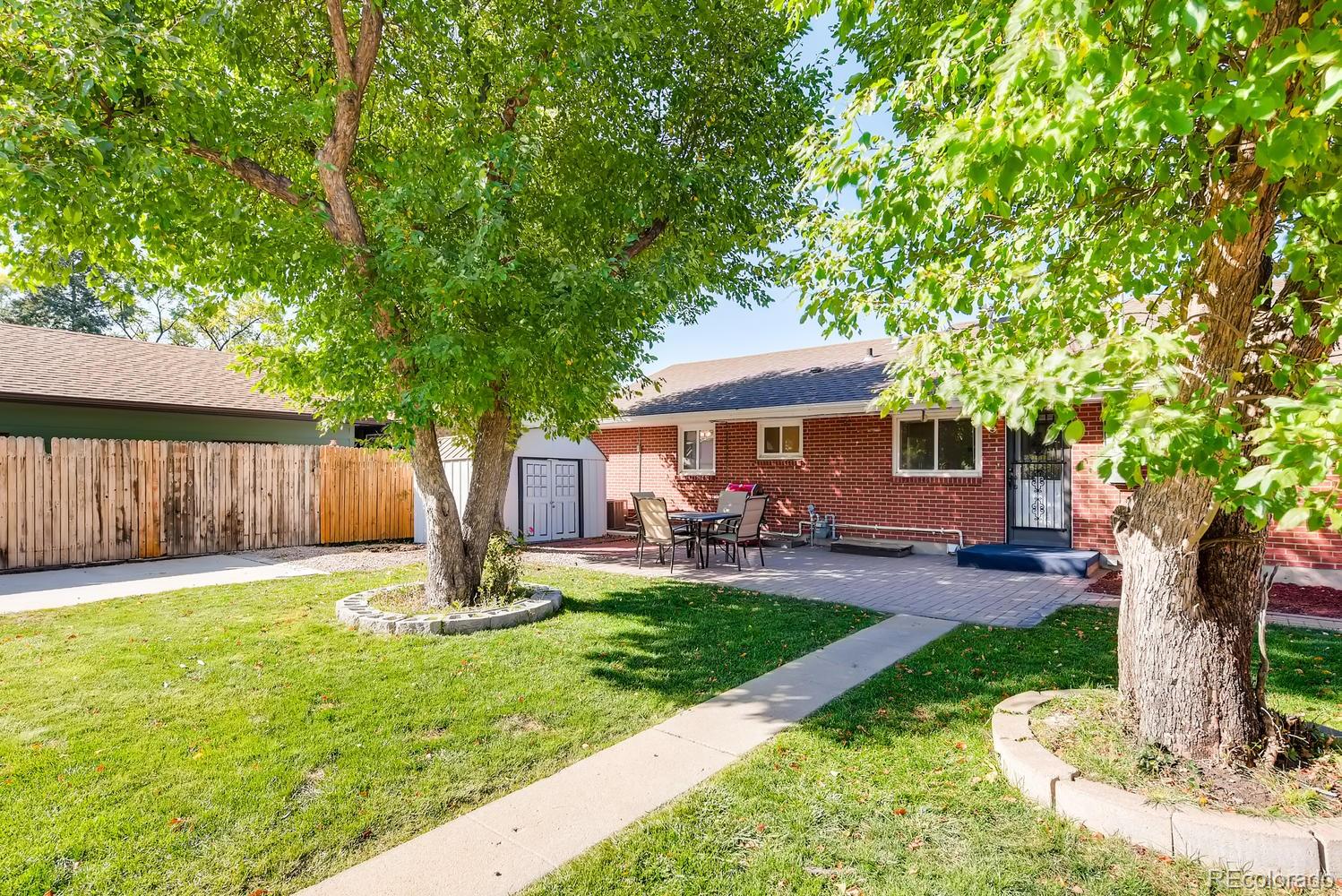 2621 Paseo Road Colorado Springs, CO 80907 - Photo 24 of 27 a front view of a house with garden and trees