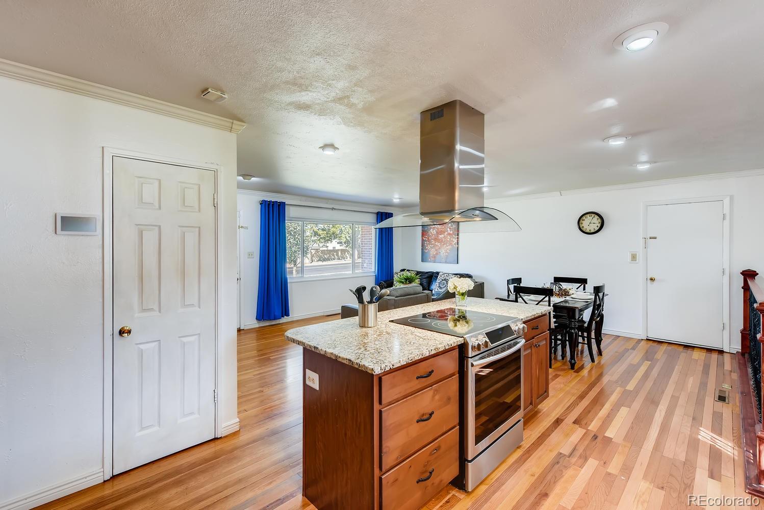 2621 Paseo Road Colorado Springs, CO 80907 - Photo 10 of 27 a kitchen that has a stove and a table in it