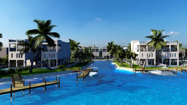 a view of swimming pool with lawn chairs and a potted plants