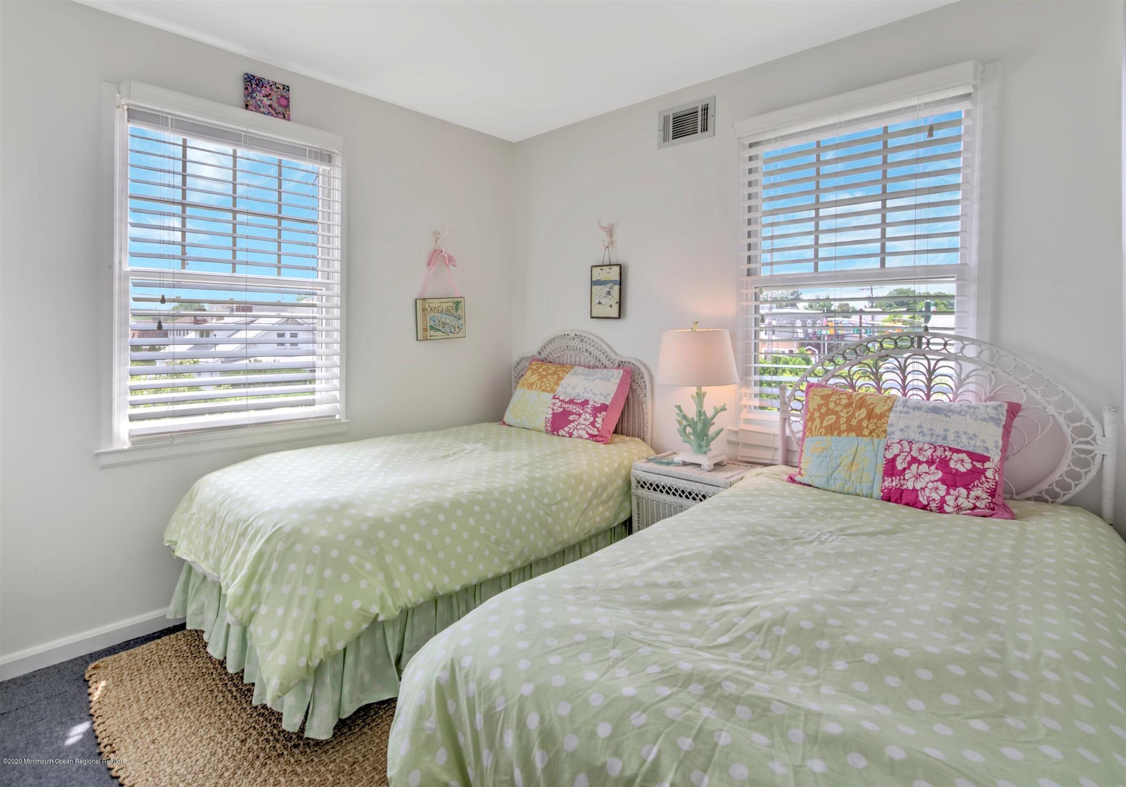 614 Ocean Road Spring Lake Heights, NJ 07762 - Photo 34 of 44 a bedroom with two beds and a window