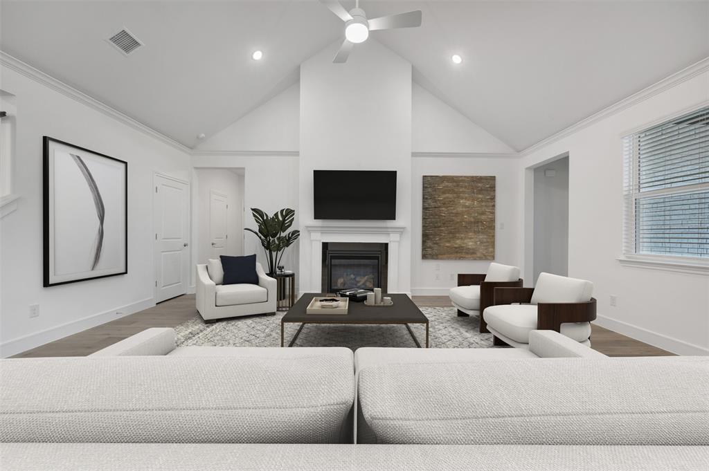 1004 Ashcroft Lane Justin, TX 76247 - Photo 1 of 39 a living room with furniture a large window and a fireplace