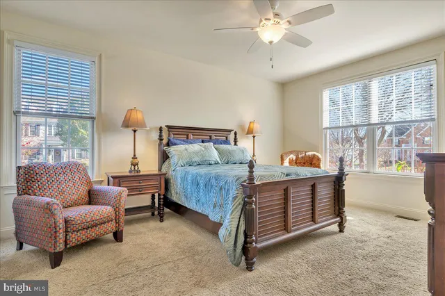 a bedroom with a bed and a couch