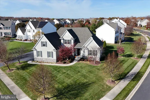 an aerial view of a house with outdoor space