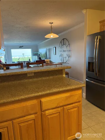 a view of a kitchen with a stove cabinets and a refrigerator
