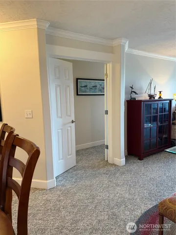 a view of a livingroom with furniture and cabinet