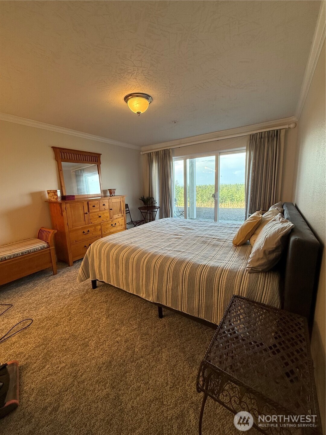 2815 Willows Road, Unit 116 Seaview, WA 98644 - Photo 17 of 30 a bedroom with a bed and window