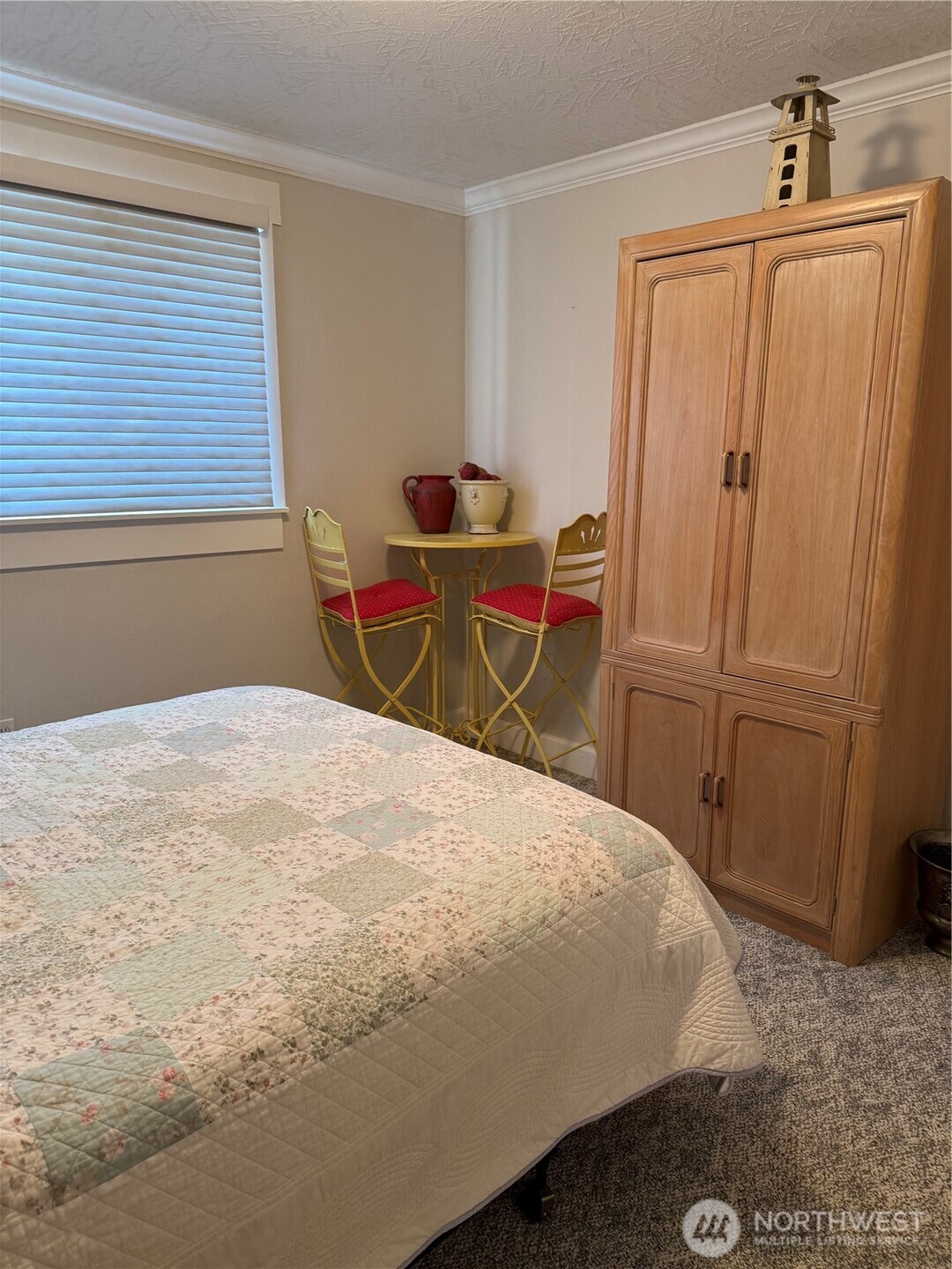 2815 Willows Road, Unit 116 Seaview, WA 98644 - Photo 23 of 30 a bedroom with a bed and wooden floor