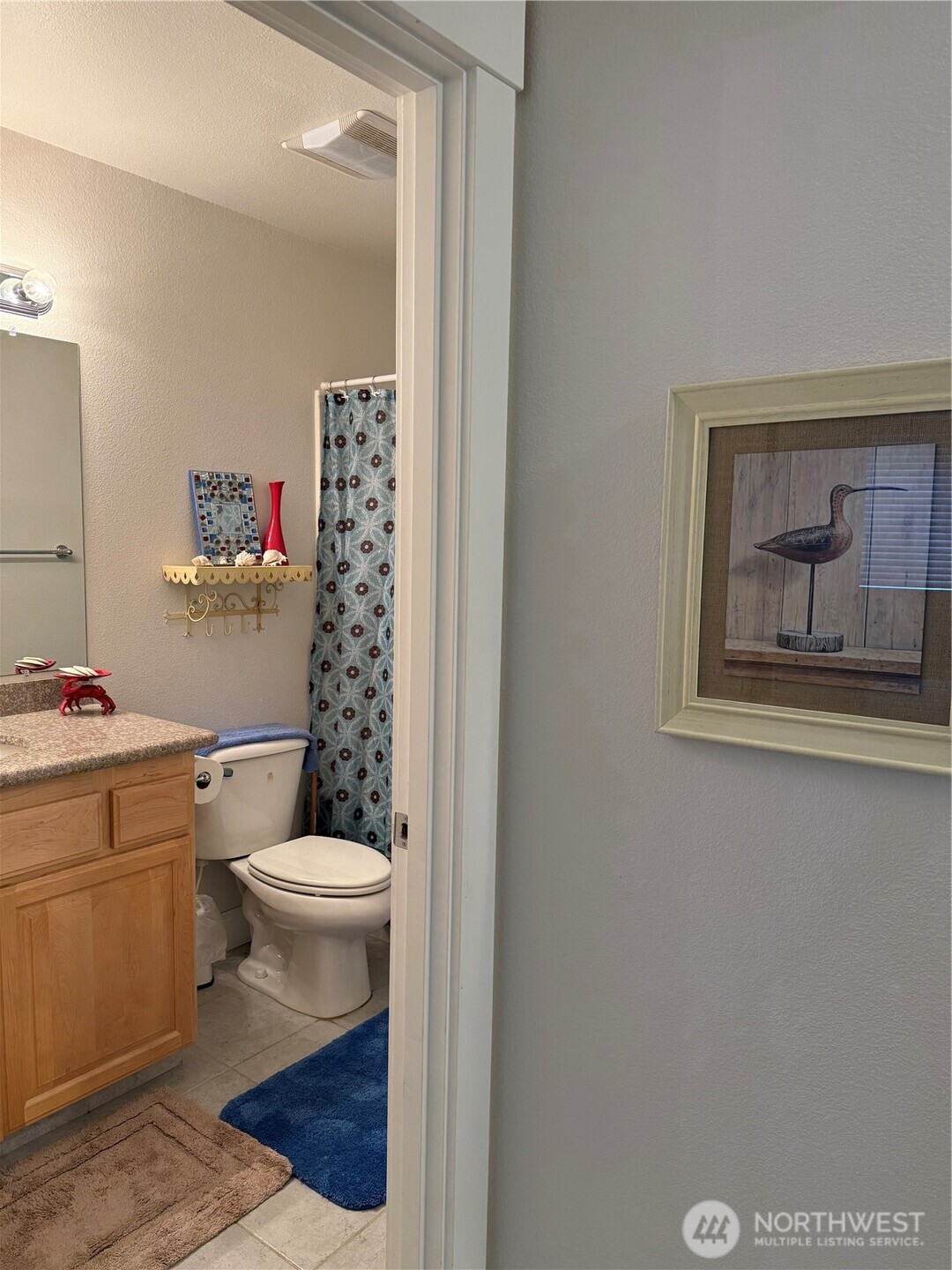 2815 Willows Road, Unit 116 Seaview, WA 98644 - Photo 25 of 30 a bathroom with a toilet a sink and a shower
