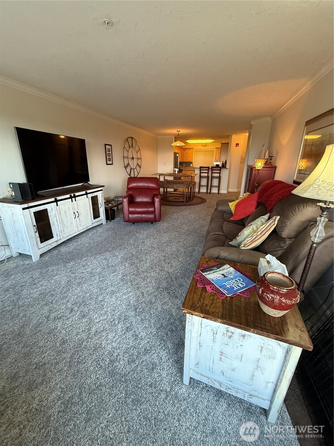2815 Willows Road, Unit 116 Seaview, WA 98644 - Photo 8 of 30 a living room with furniture and a flat screen tv
