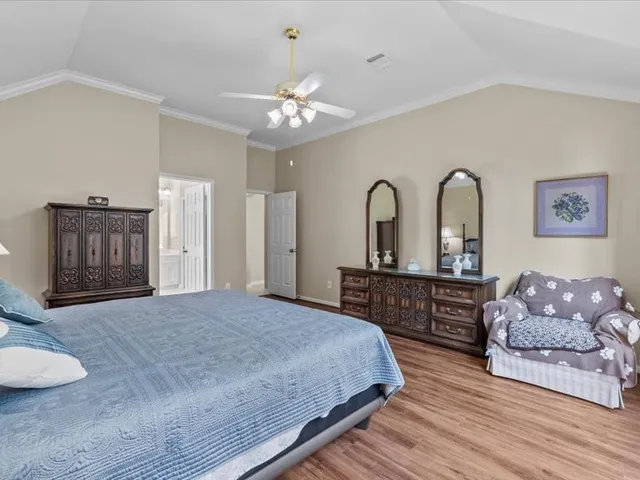 a bathroom with a tub shower and sink