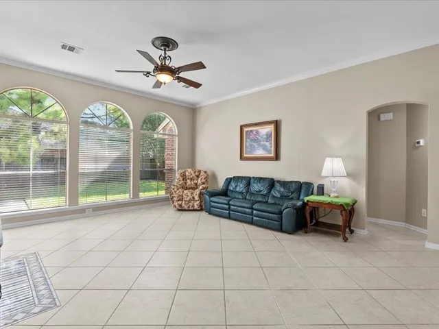 a dining room with furniture and chandelier