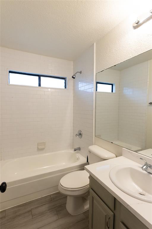 1031 East Peters Colony Road Carrollton, TX 75007 - Photo 13 of 21 a bathroom with a sink a toilet and shower