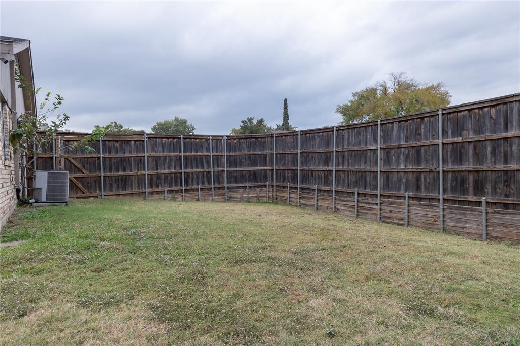 1031 East Peters Colony Road Carrollton, TX 75007 - Photo 19 of 21 a view of a room with wooden shelves