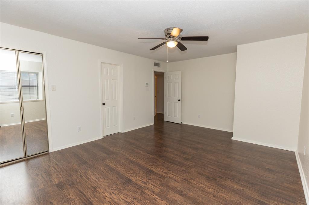 1031 East Peters Colony Road Carrollton, TX 75007 - Photo 8 of 21 a view of empty room with wooden floor