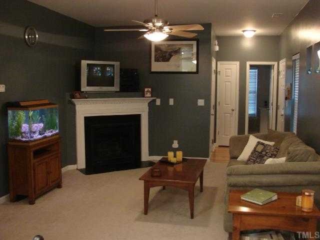 2125 Persimmon Ridge Drive Raleigh, NC 27604 - Photo 2 of 12 a living room with furniture and a fireplace
