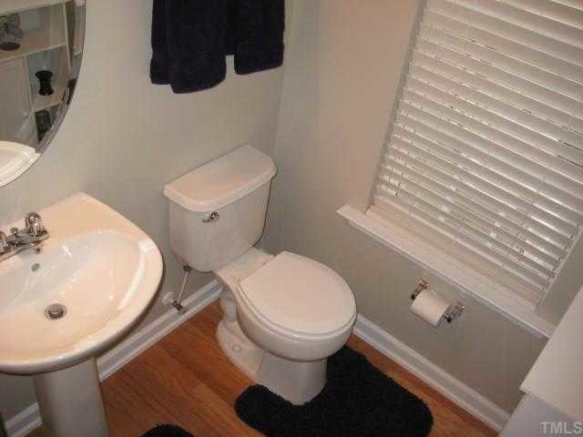 2125 Persimmon Ridge Drive Raleigh, NC 27604 - Photo 5 of 12 a bathroom with a sink and a toilet
