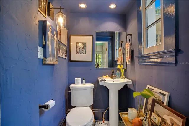 a kitchen with stainless steel appliances granite countertop a stove refrigerator and a sink