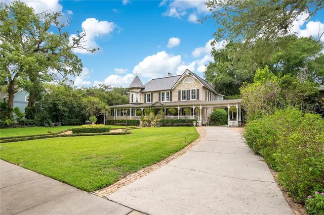 a front view of a house with a yard table and chairs