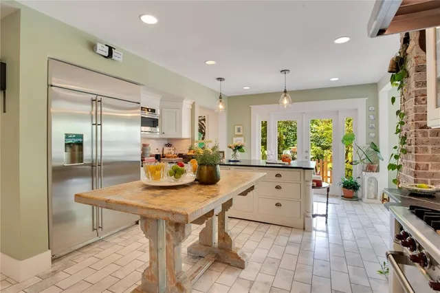 a living room with fireplace furniture and a flat screen tv