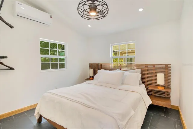 a living room with fireplace furniture and a chandelier