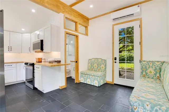 a view of a chairs and table in the balcony