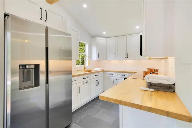 a view of a livingroom with furniture and a fireplace