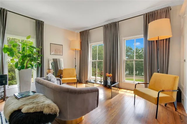 an aerial view of a house with outdoor space pool seating area and yard