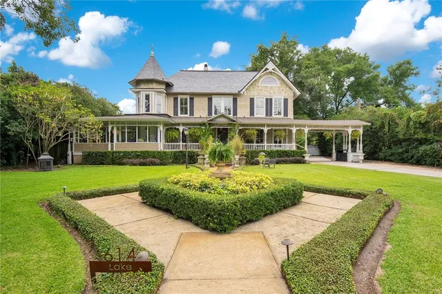 a potted plant sitting in front of a house
