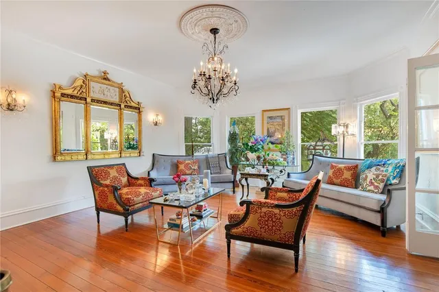 a view of a room with gym equipment and large windows