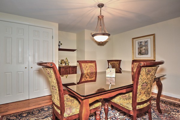 12 Williams Road Sturbridge, MA 01566 - Photo 14 of 30 a view of a dining room with furniture and a chandelier