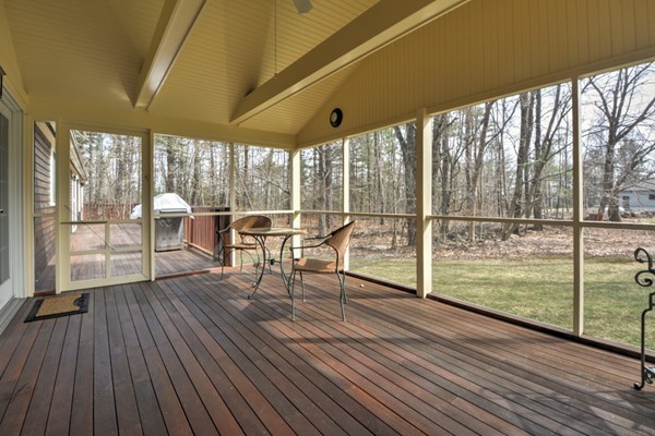 12 Williams Road Sturbridge, MA 01566 - Photo 23 of 30 a living room with large windows and wooden floor