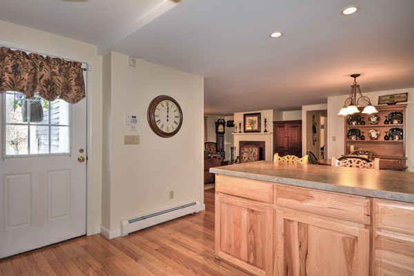 12 Williams Road Sturbridge, MA 01566 - Photo 3 of 30 a view of a kitchen with fridge and wooden floor